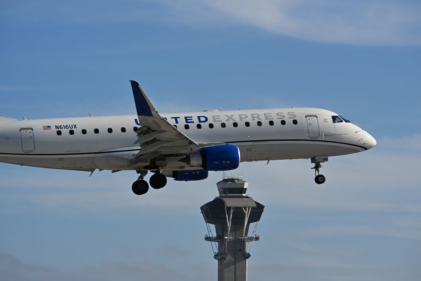A regional jet on short final at LAX, passing the control tower